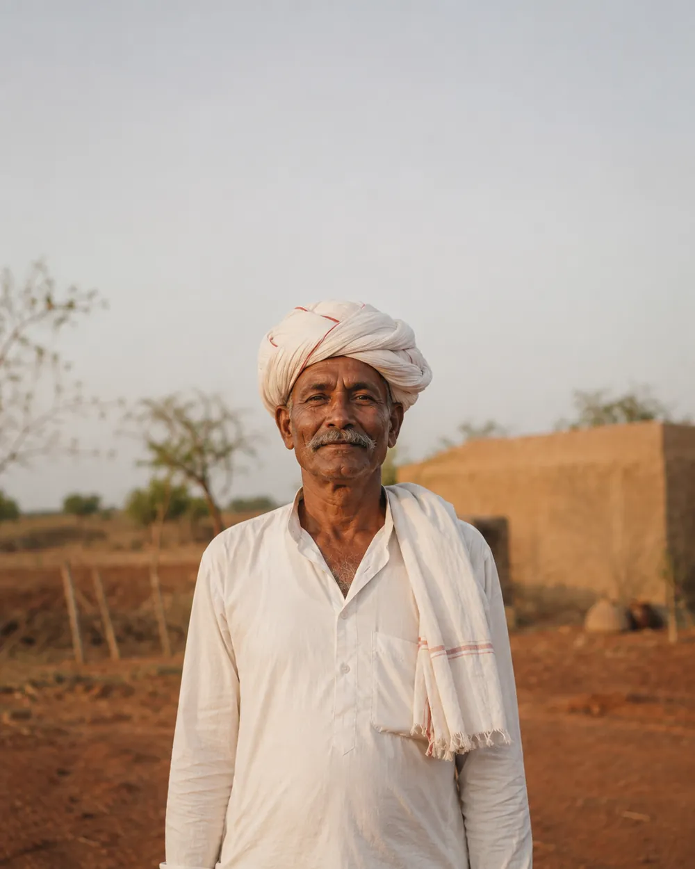 Portrait of a farmer in a white kurta and gamcha.